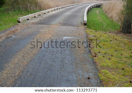 asphault approach to timber bridge