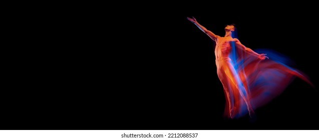 Aspiration. Solo Performance Of Flexible Male Ballet Dancer Dancing Isolated On Dark Background In Glowing Colorful Neon Light. Grace, Art, Beauty, Contemp Dance Concept. Actor Flying, Jumping. Flyer