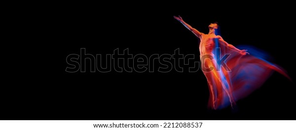 Aspiration. Solo performance of flexible male\
ballet dancer dancing isolated on dark background in glowing\
colorful neon light. Grace, art, beauty, contemp dance concept.\
Actor flying, jumping.\
Flyer