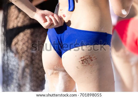 Similar – Anonymous woman applying sunscreen by the poolside