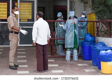 Assam, India. 2 March 2020. Health Worker Helping Wearing PPE Kit To An Another Health Worker At Guwahati Medical College Hospital, During Nationwide Lockdown In The Wake Of Coronavirus Pandemic.