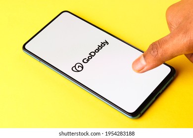 Assam, india - April 10, 2021 : GoDaddy logo on phone screen stock image.