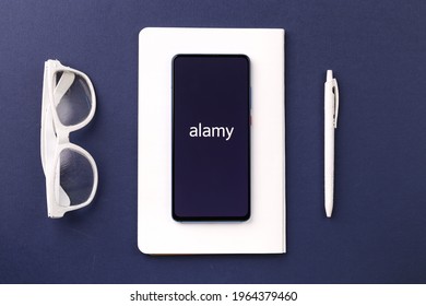 Assam, india - April 19, 2021 : Alamy logo on phone screen stock image.