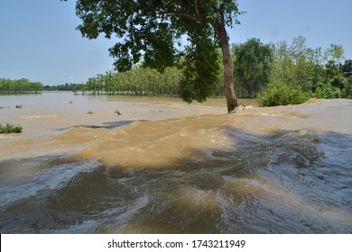 Assam / India - May 28 2020:The Heavy Flow Of Flood Water Submerged The Road Connecting Kampur Town With Jamunamukh  In Nagaon District Of Assam.