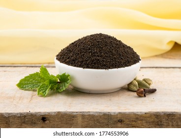 Assam Indian Black Tea (chai)  Patti Powder Served In White Bowl Mari Masala Tea.