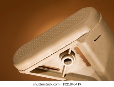 Assault Rifle Recoil Pad That Is On A Tan Background