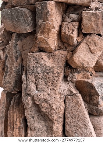 An assemblage of large granite rocks, or perhaps boulders, forms a marker near the Santa Cruz River. Detail. Chimayo NM 2026