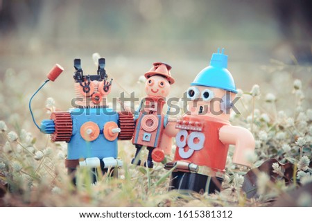 Assemblage robot sculptures family In the lawn