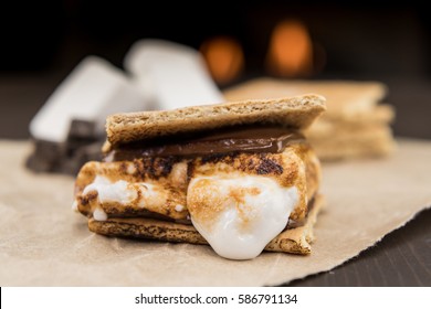 Assembled Smore on Brown Paper in front of fire