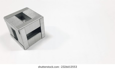 assembled staple cube from a complete pack of 1000 pieces on the isolated white