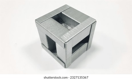 assembled staple cube from a complete pack of 1000 pieces on the isolated white