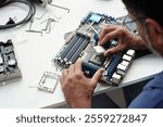 Assembling Computer Parts on White Table