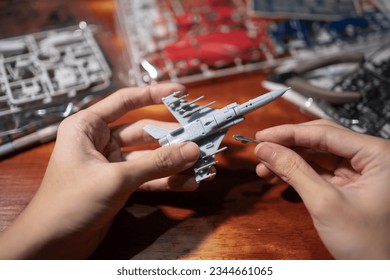 Assembling jet plane plastic model kit
