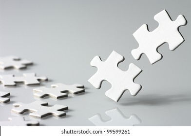 Assembling a jigsaw puzzle.