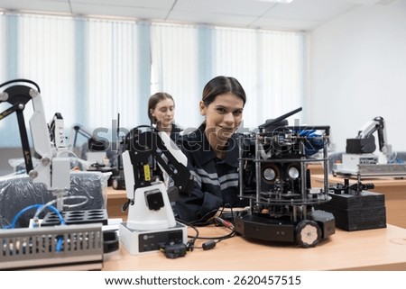 Assembling Robotic Arm. Engineer training and test programmable logic controller with AI robot training kit and mechatronics engineering in workshop
