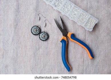 Assembly Of Black And White Bib Tribal Earrings From Polymer Clay In African Style. Unfinished Jewelry With Tools.