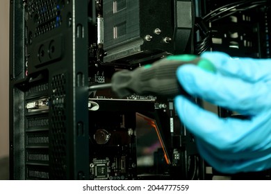 Assembly, configuration and repair of personal computers in PC service. Professional technician collects parts computer equipment. Close-up connecting computer. Occupation concept. Copy space for site - Shutterstock ID 2044777559