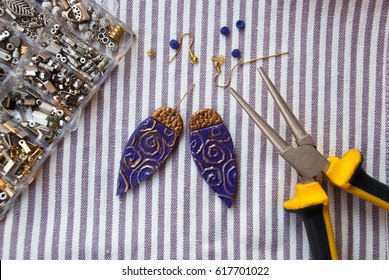 Assembly earrings bohemian style from polymer clay and tools   pliers  