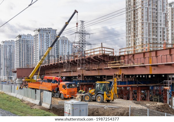 Assembly of metal structures during the construction\
of an automobile overpass. Construction of the North-East Chorda -\
SVH or SVKh. Russia, Moscow, Botanichesky Sad metro station -\
August 26, 2020