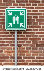 Assembly point in case of danger in front of brick wall