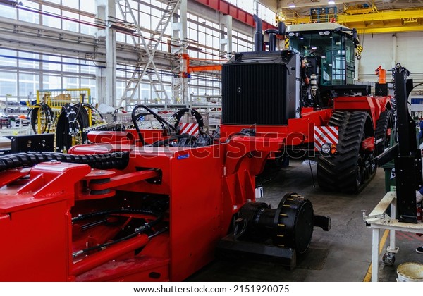 Assembly process of agricultural tractors in\
industrial workshop.