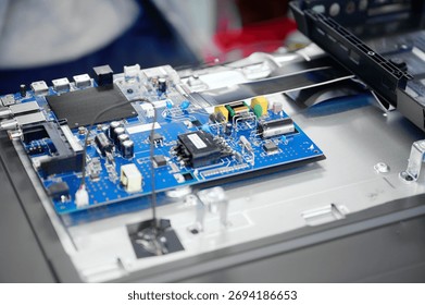 Assembly process of electronic components at television production facility