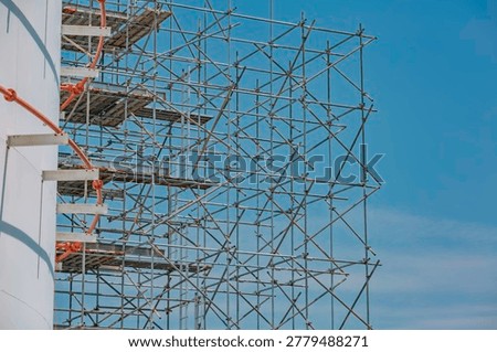 Assembly in progress storage tank oil inspection scaffolding work at high
