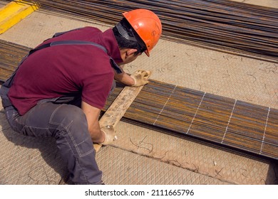 Assembly of reinforcing bars for pouring concrete. Industrial background. Rebar texture Steel rebar for reinforcement concrete at construction site.