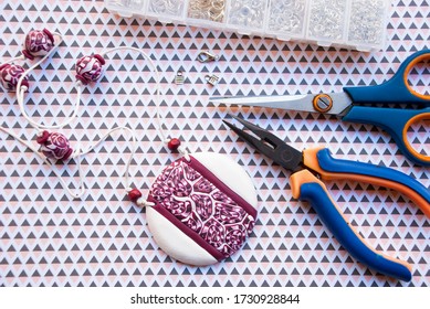 Assembly Of Tribal White And Claret Round Pendant. Handmade Jewelry.