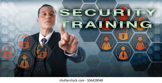 Assertive Corporate Manager Is Activating SECURITY TRAINING On A Virtual Control Screen. Business Metaphor And Information Technology Concept For Instruction Of Employees In Computer Security.