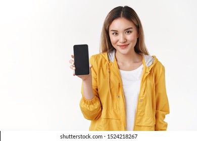 Assertive Motivated Empowered Good-looking Asian Sassy Happy Girl Smiling Confident Hold Smartphone Show Display Phone Screen Present Her Dating Lgbtq App Suggest Application Promoting Social Media