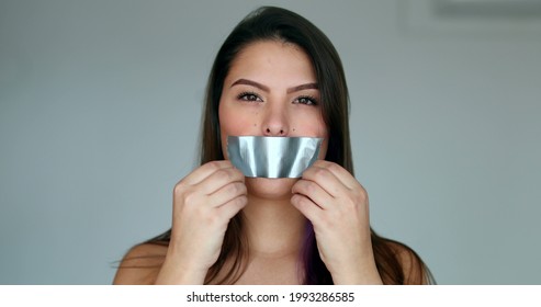 Assertive Woman Removing Tape From Mouth Feeling Relief And Freedom To Speak