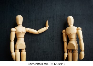 Assertiveness and confidence concept. Two wooden figurines on the dark surface. - Shutterstock ID 2147162141