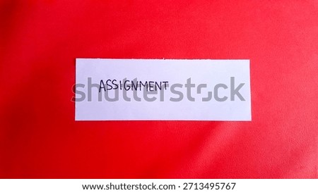 Assignment written on a red background