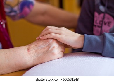 Assistance and confidence. Adult hand hold kids hand - Powered by Shutterstock