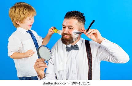 Assistant For Dad. Son And Father Shaving Beard Together. Barbershop. Beard Care. Little Barber.