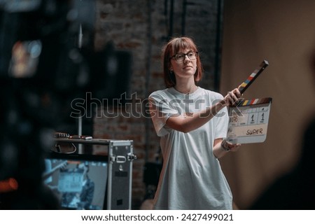 Assistant director with clapperboard on set. Close-up of firecrackers for filming a movie, advertising, TV series. Modern photography technique.