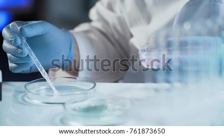Assistant of reproductive medicine clinic fertilizing egg outside female body