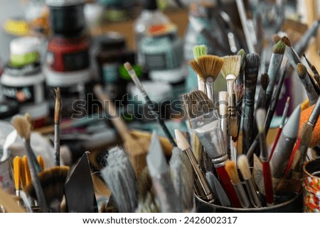 Assorted art painter brushes of different styles tip up