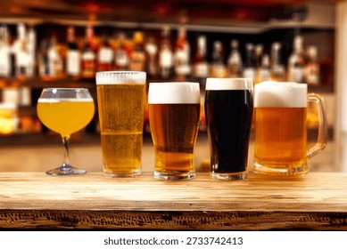 Assorted beer glasses lined up on a bar counter
Beer tasting selection with different styles and colors
Variety of craft beers served in glasses at the bar
