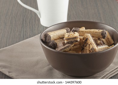 Assorted biscuits of different kind in a brown cup