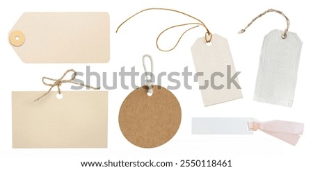 Assorted blank tags with strings, including rectangular, circular, and textured designs. Perfect for labeling, crafting, and organizing. Paper gift labels isolated on white background.