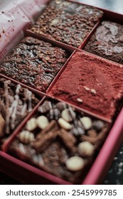 Assorted brownies and baked treats arranged in a gift box, featuring a variety of flavors and textures, perfect for gifting or indulgent snacking.