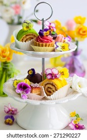 Assorted Cakes And Pastries On A Cake Stand For Afternoon Tea