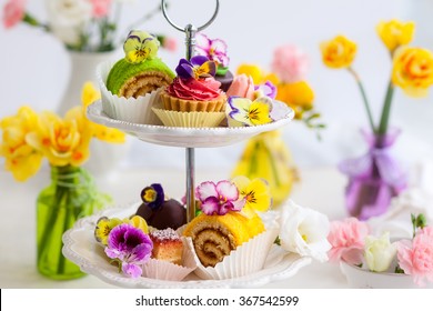 Assorted Cakes And Pastries On A Cake Stand For Afternoon Tea