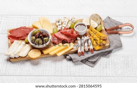 Assorted cheeses and cured meats served as a perfect accompaniment to wine, gourmet dining concept