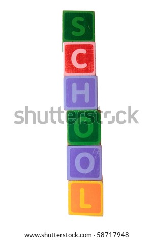 assorted childrens toy letter building blocks against a white background that spell school with clipping path
