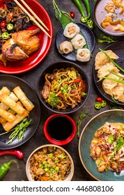 Assorted Chinese Food Set. Chinese Noodles, Fried Rice, Dumplings, Peking Duck, Dim Sum, Spring Rolls. Famous Chinese Cuisine Dishes On Table. Top View. Chinese Restaurant Concept. Asian Style Banquet