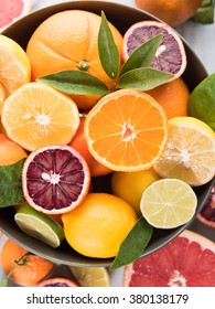 Assorted Citrus Fruit In Bowl On Marble Counter