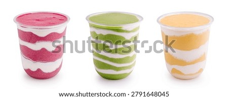 Assorted cold yogurt smoothies are presented on a white background. Set of takeaway layered drinks includes strawberry kiwi and mango flavours.